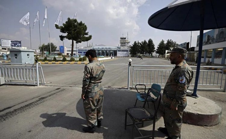 Afghan Police Back At Work Alongside Taliban At Airport